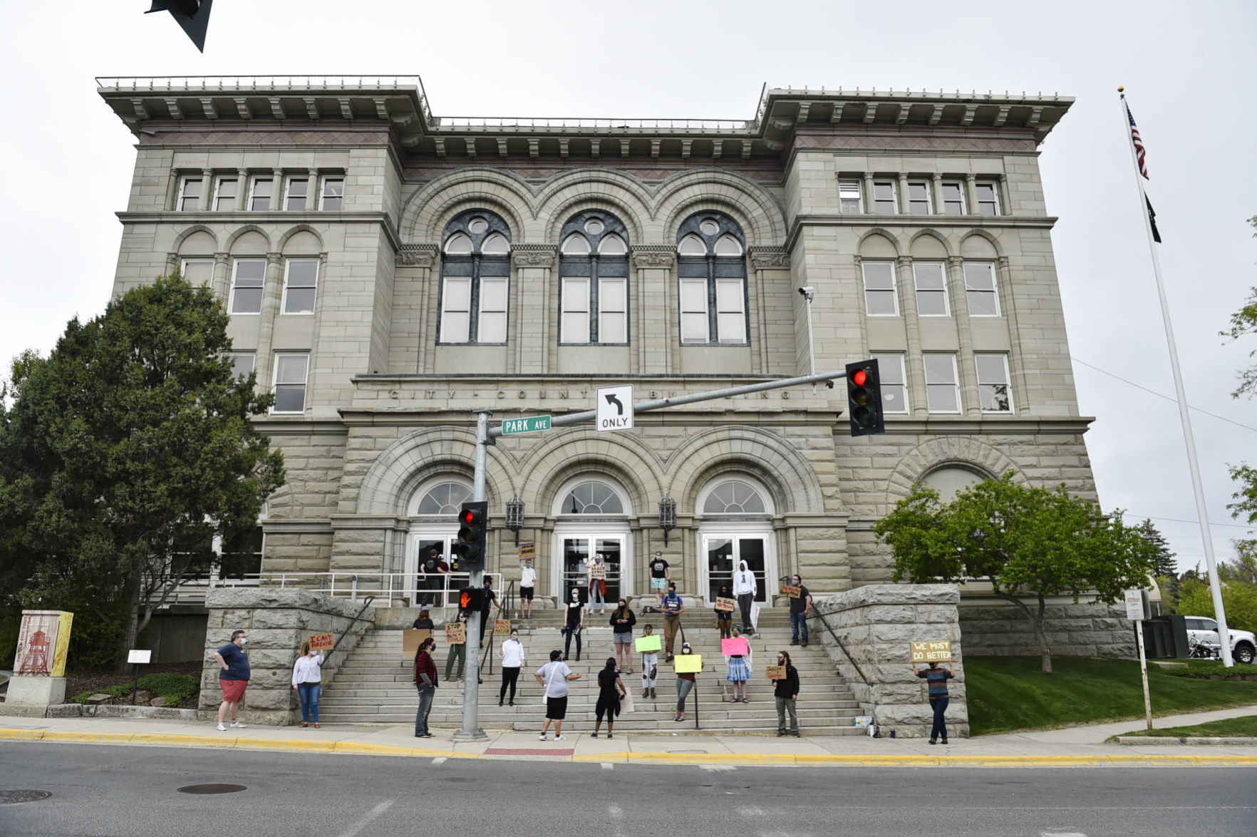 Protesters gather on the steps of the City-County Building Friday